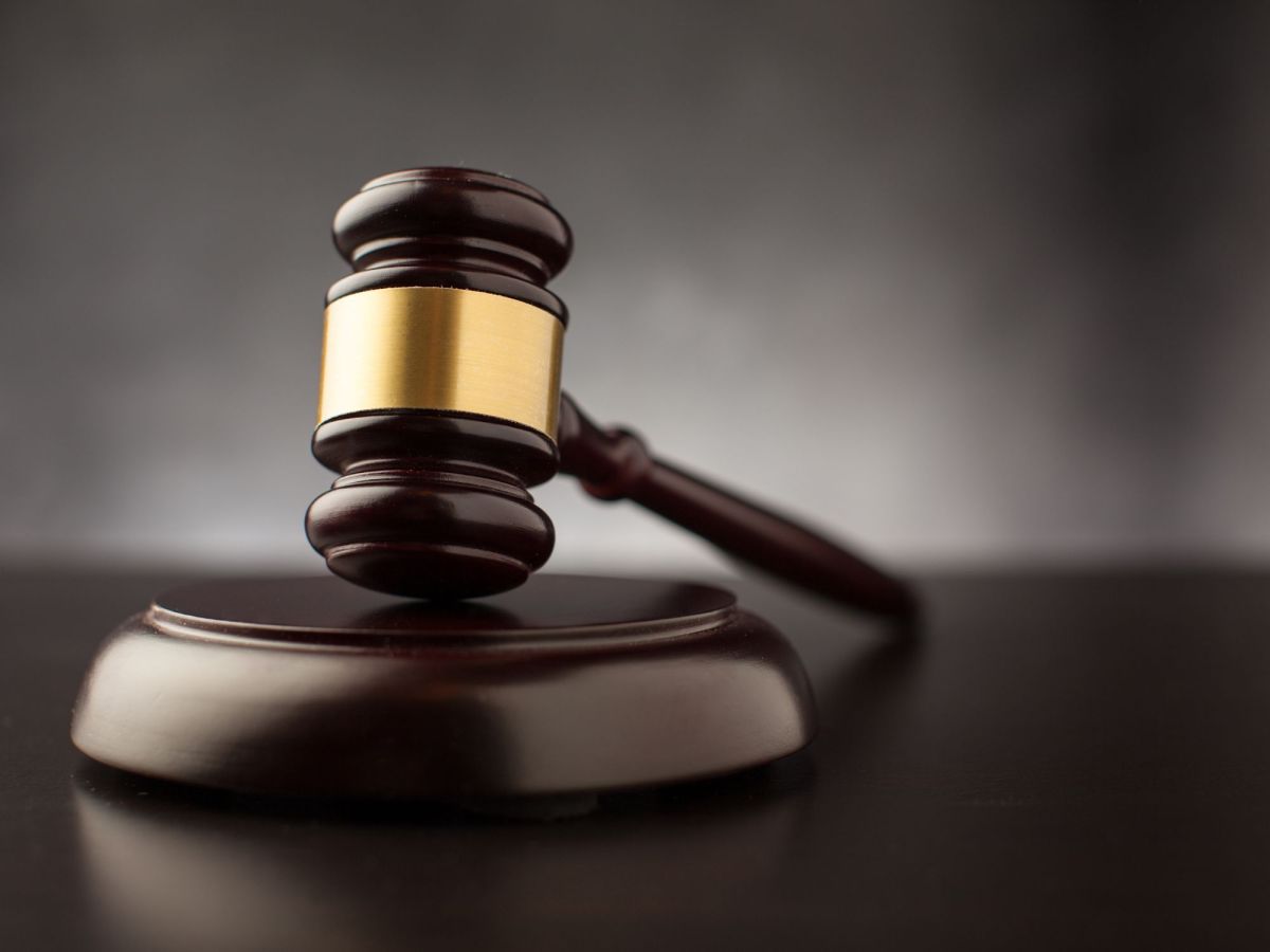 A dark wood and brass gavel