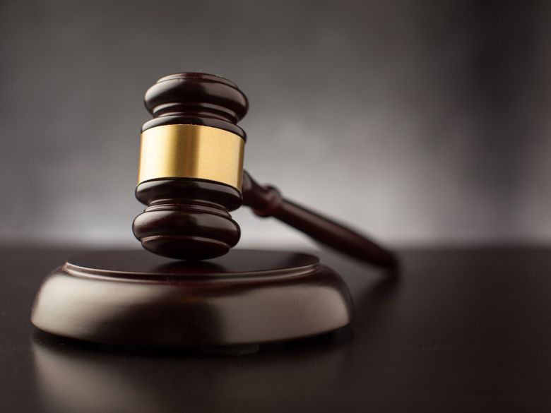 A dark wood and brass gavel